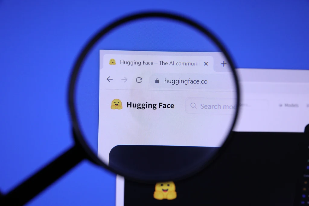 Homepage of HUGGING FACE Website magnified on logo with magnifying glass (53146954891).jpg