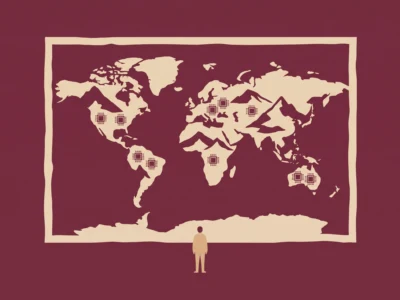Person standing in front of a large world map with highlighted data pins across continents.