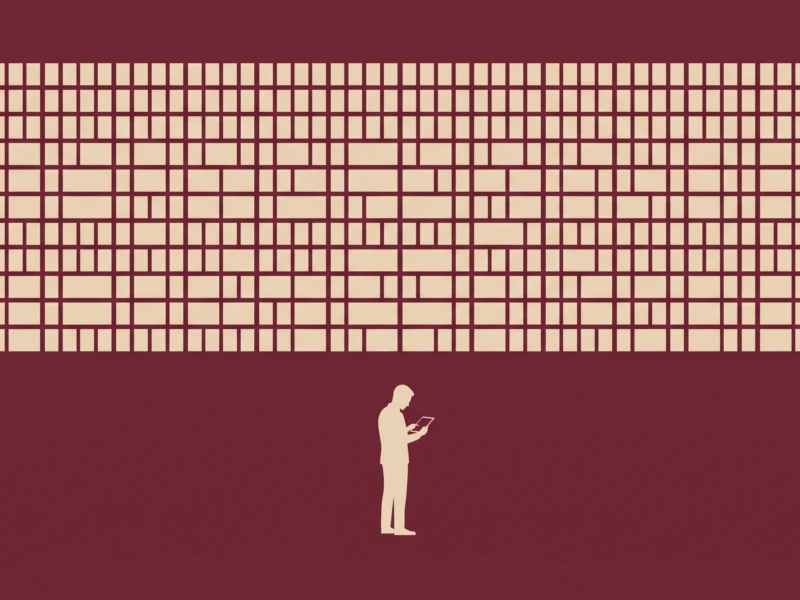 Silhouetted person holding a tablet, standing in a burgundy room beneath a large beige grid wall pattern.