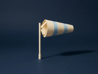 Miniature beige and blue striped paper wind sock mounted on a wooden stick against a dark blue background, suggesting wind direction.