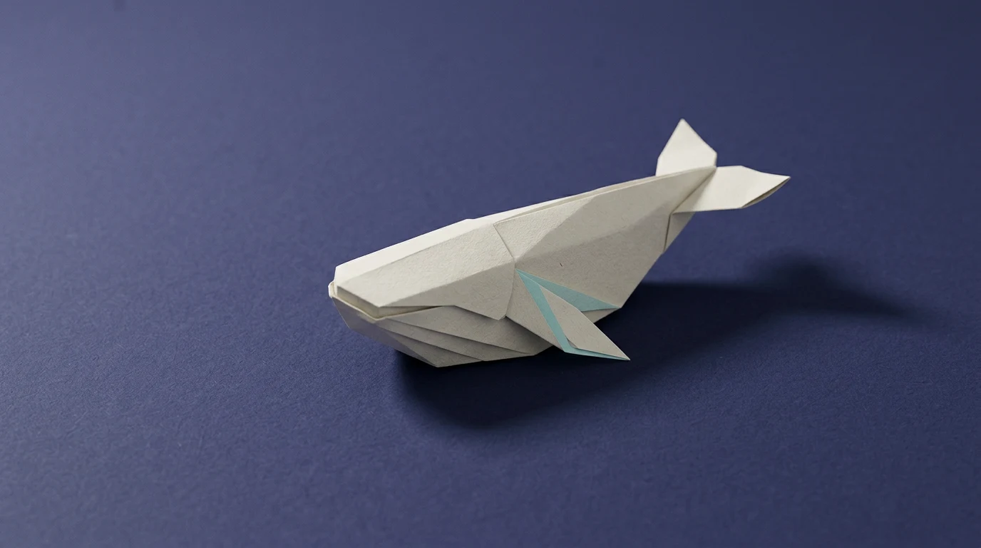 Origami white/gray fish with teal accents on a blue background, facing left.