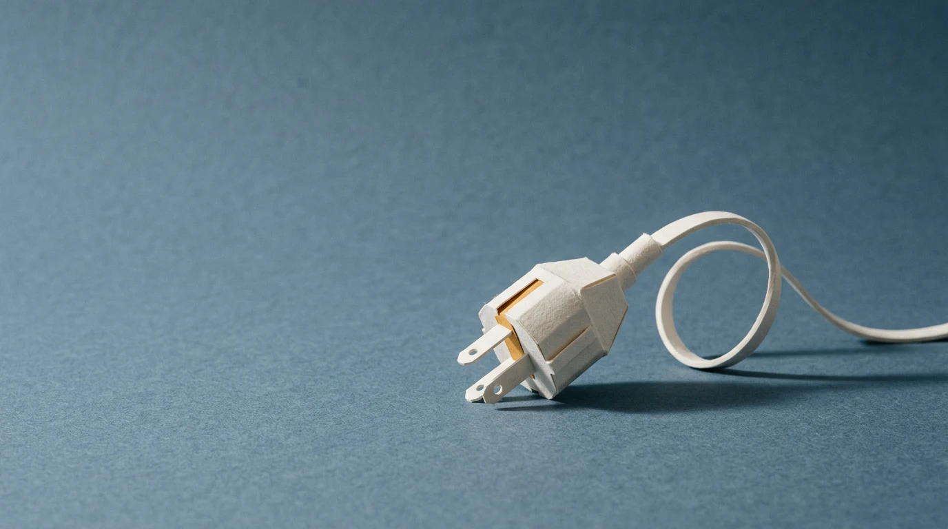 MCP Model Context Protocol co to jest i po co modelom wspólny standard wtyczek - Promptowy White two-prong electrical plug with a cord on a blue textured surface, angled to the right, close-up view