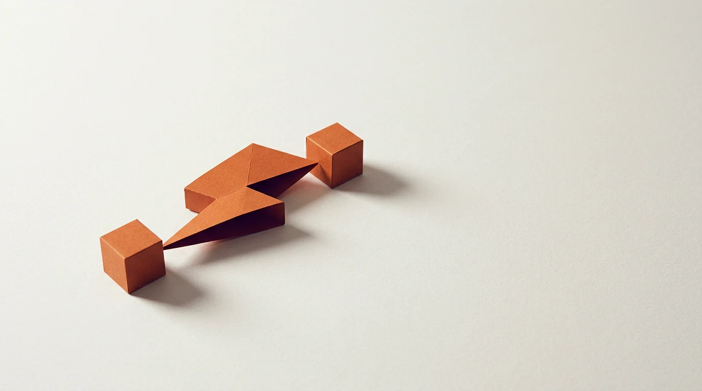 Zapier co to jest ile kosztuje i kiedy wybrać zamiast niego Make albo n8n - Promptowy Orange origami cubes connected by a folded strip on a pale background, forming a short chain arrangement on white surface